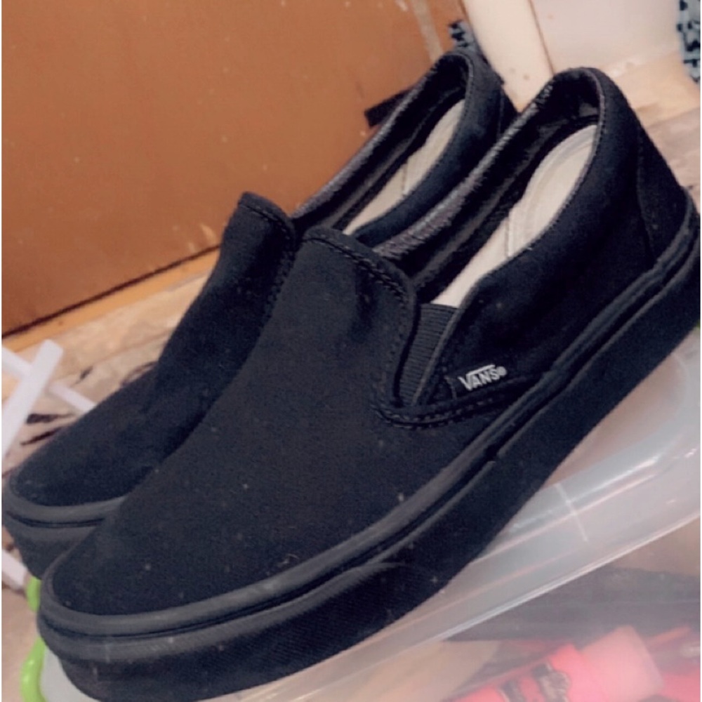 Black slip on Vans.